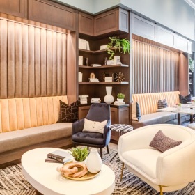 Your new favorite social area a room with a couch and chairs