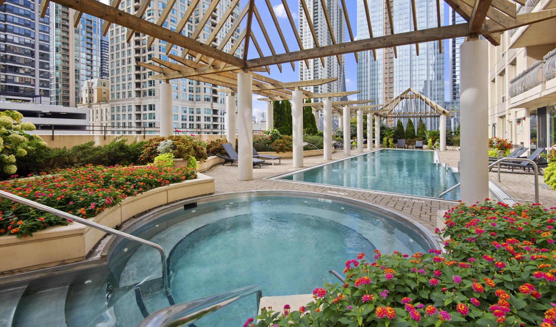 Settle into comfort at The Bernardin Apartments a large water fountain in a courtyard