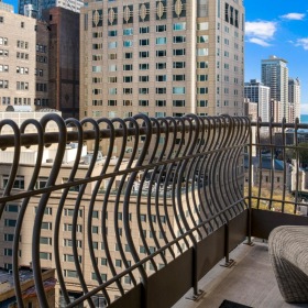 Spacious balconies a view of a city from a balcony