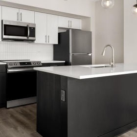 A new standard of living a kitchen with black appliances